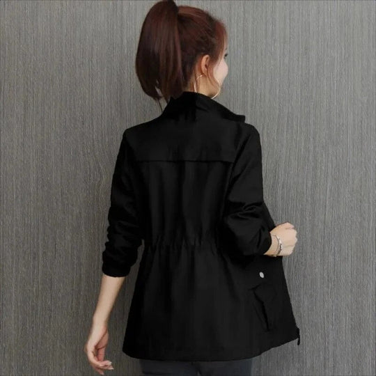 Front view of women's beige waterproof trench coat, a versatile and elegant outerwear for all seasons