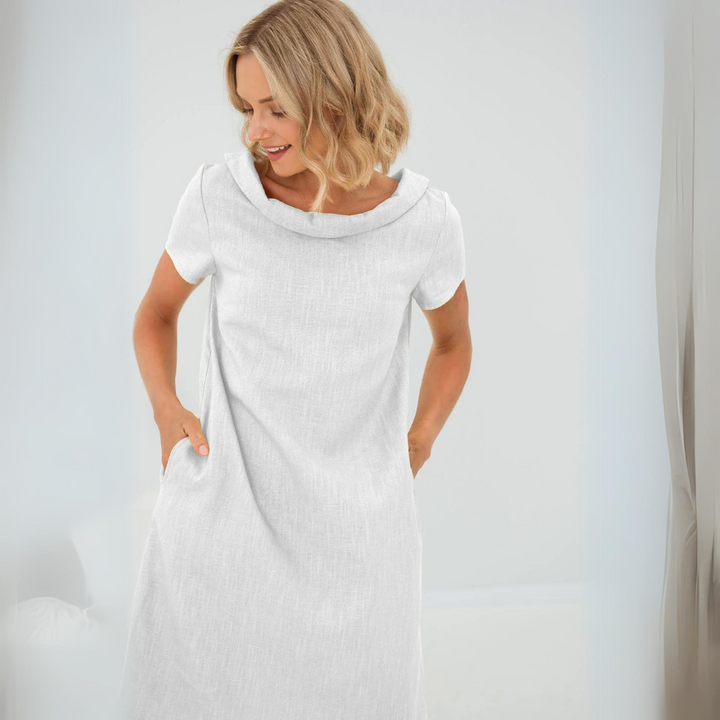 Elegant women's linen summer day dress. Short sleeve, pockets, and a cool, casual style for warm weather.