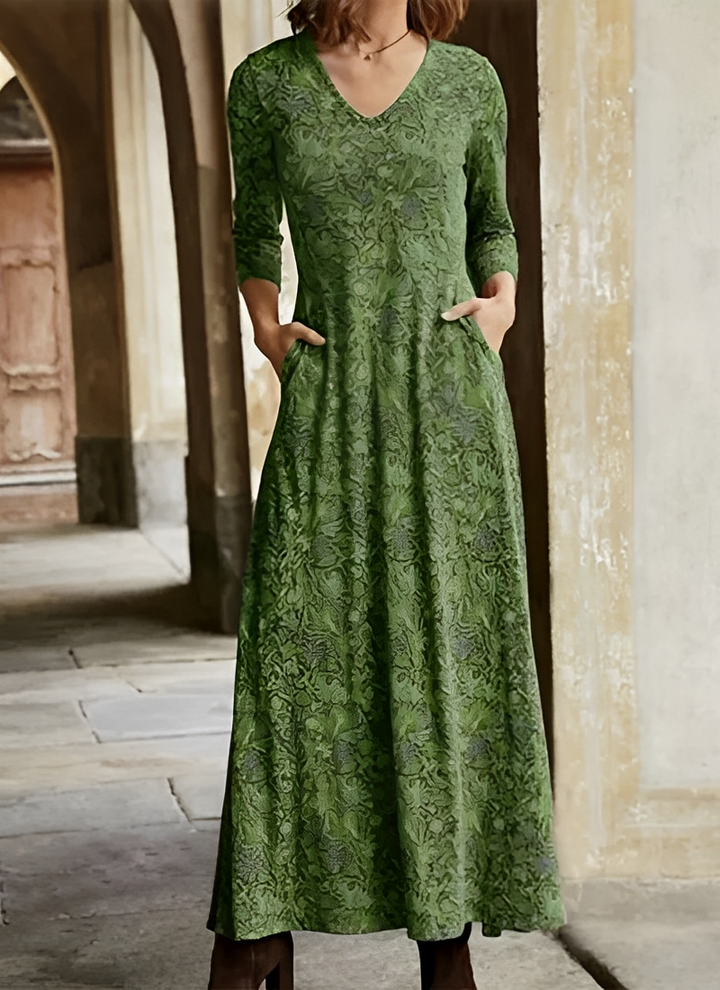 Women's elegant maxi dress with a vibrant retro pattern and a timeless, classic fashion appeal.