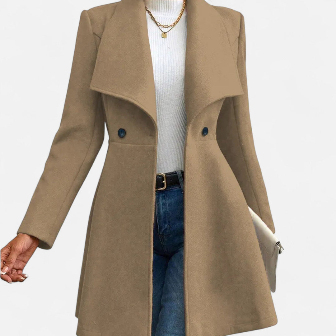 Warm women's elegant long winter coat with a lapel. Versatile outerwear for classic, formal, or casual chic.