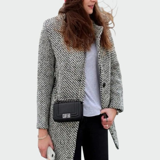 Fashionable women's long coat, tailored fit, exuding elegance and sophisticated style for winter.