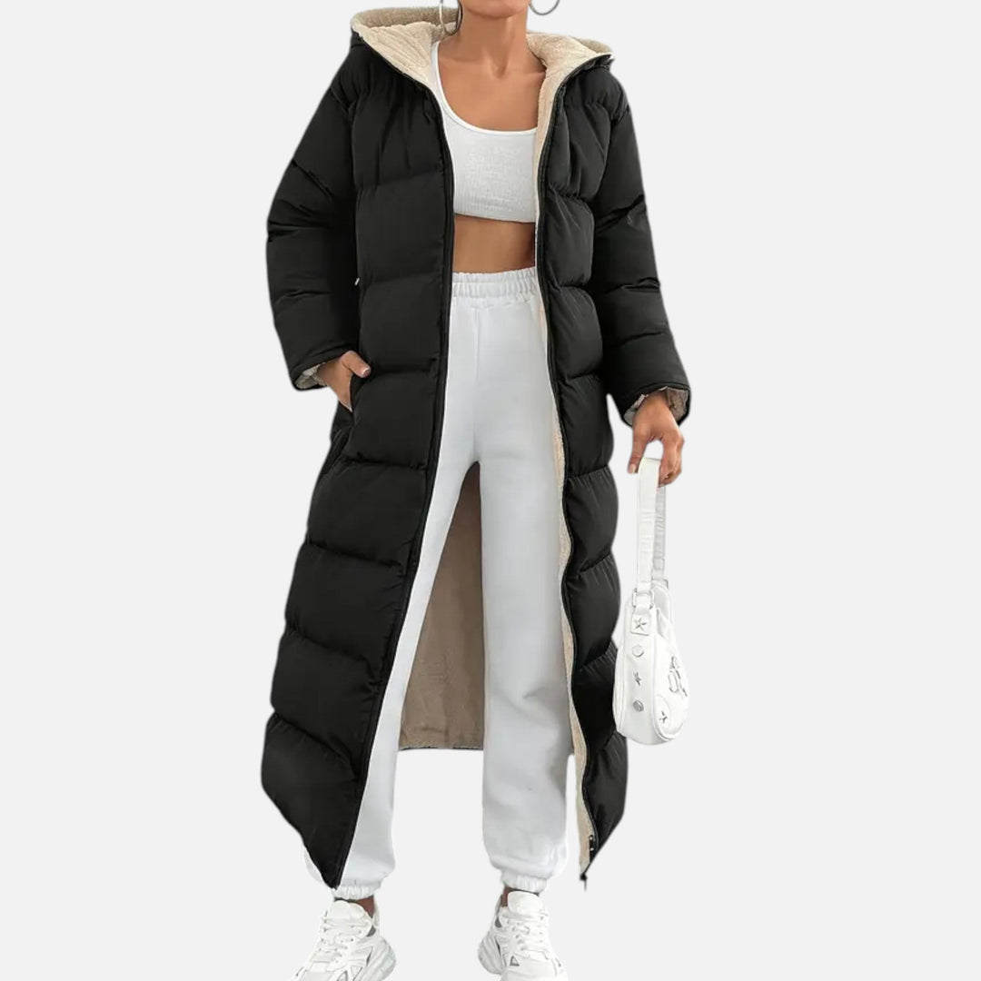 Stylish women's long puffer jacket. Ideal for ultimate winter warmth and comfort in cold weather.