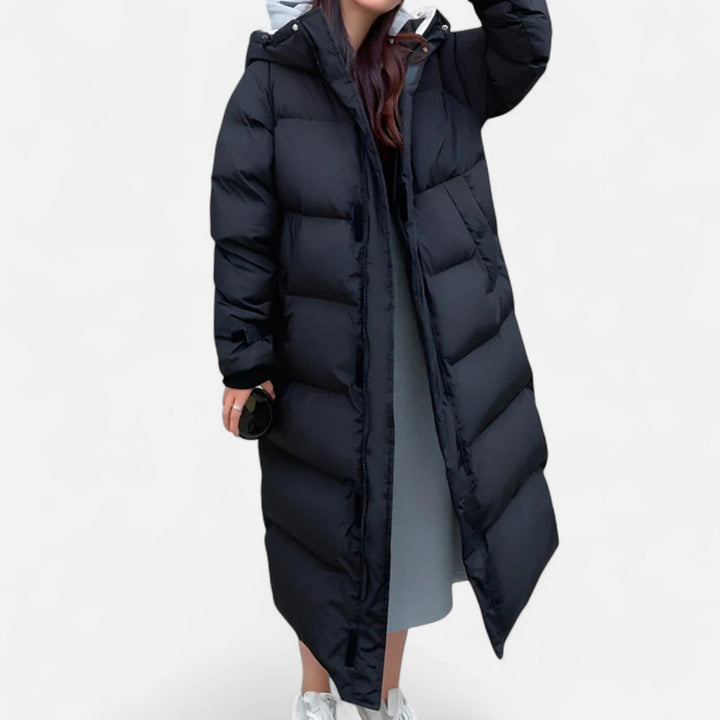 Elegant women's long puffer jacket, weatherproof & warm. Perfect for stylish cold weather outerwear.