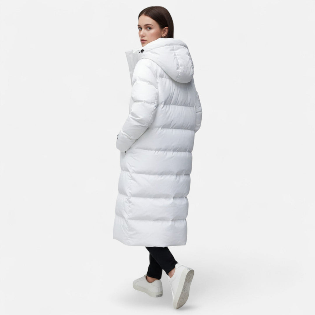 Fashionable women's long puffer coat, designed for ultimate warmth and elegant winter style.