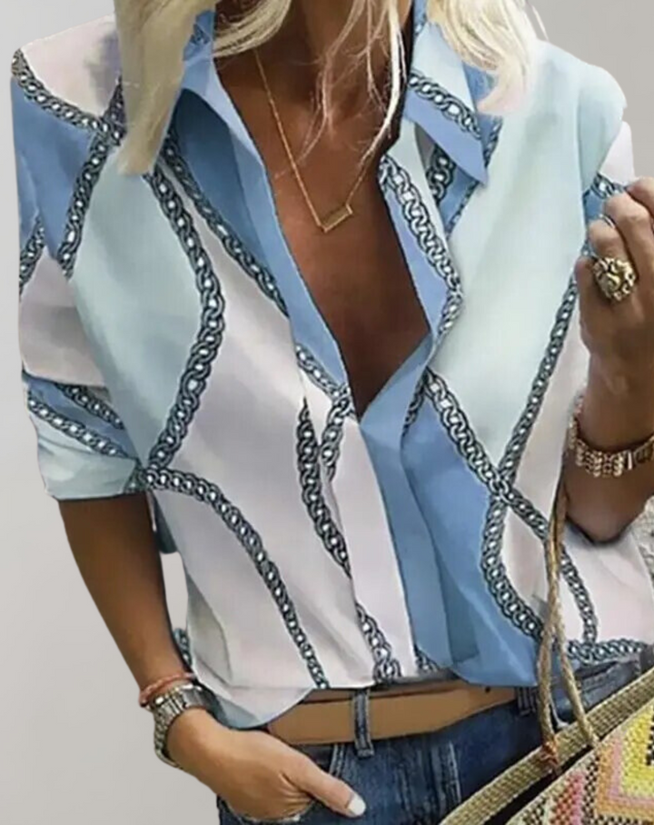 Fashionable women's blouse with an intricate chain pattern, an elegant long sleeve top for modern women's apparel.