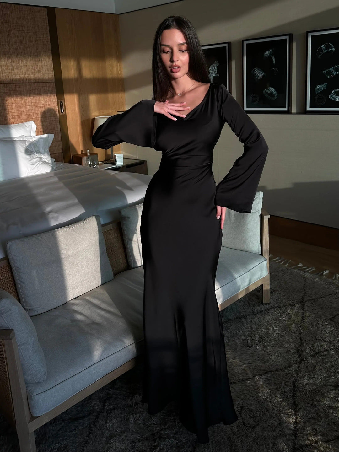Sophisticated women's long sleeve maxi dress for evening, a classic formal gown with elegant drape.