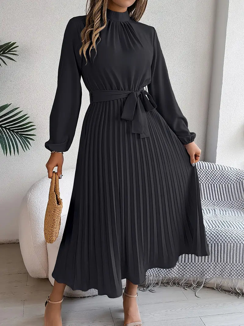 Stylish women's long sleeve belted maxi dress, showcasing its comfortable fit and elegant pleats.