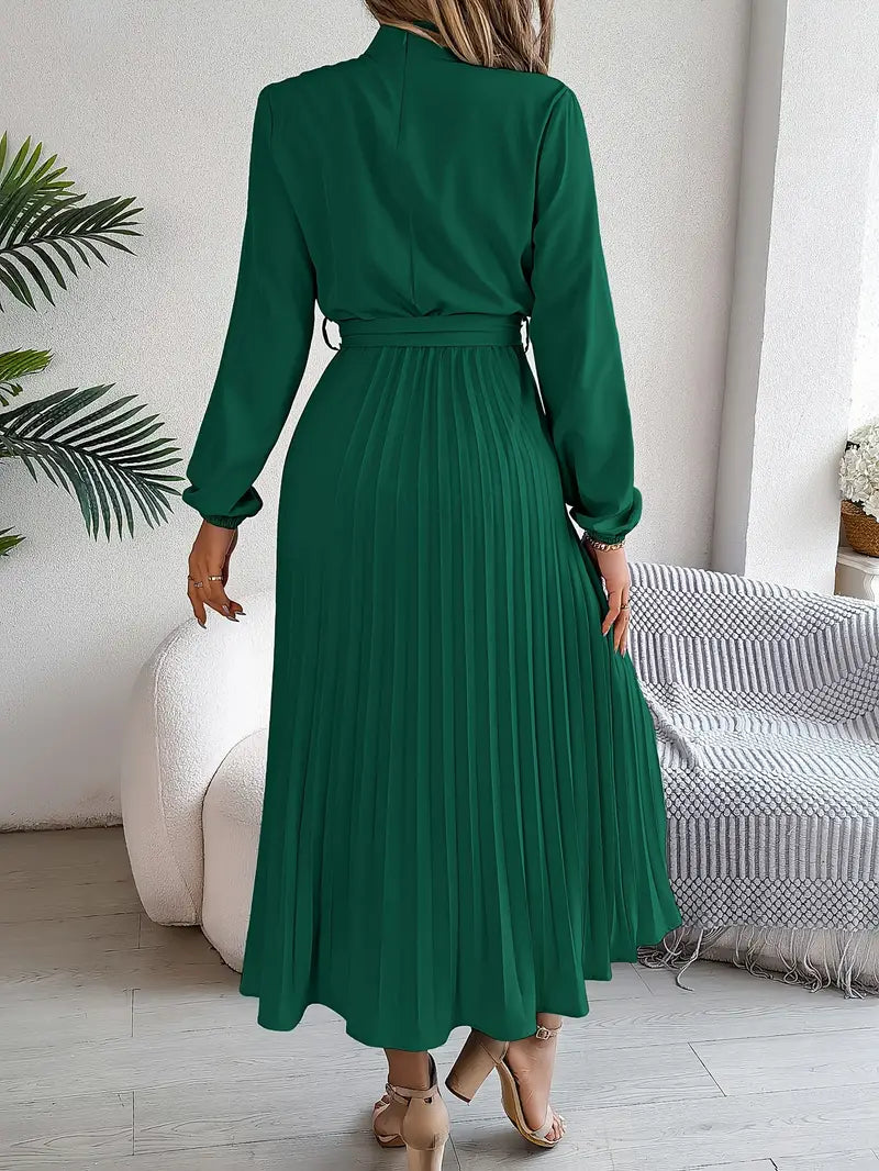 Back view of a women's long sleeve pleated belted maxi dress, highlighting its graceful drape and fit.