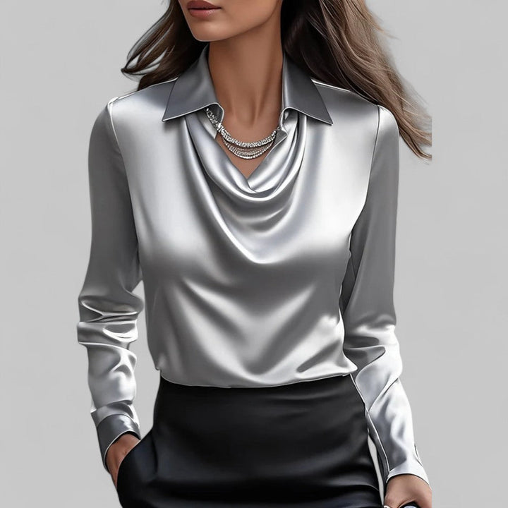 Silky long sleeve women's satin blouse, a fashionable and elegant top for party or professional settings.