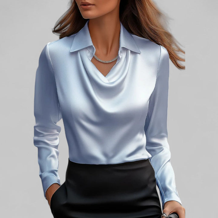 Women's elegant and silky long sleeve satin blouse, a stylish choice for any formal occasion or office.