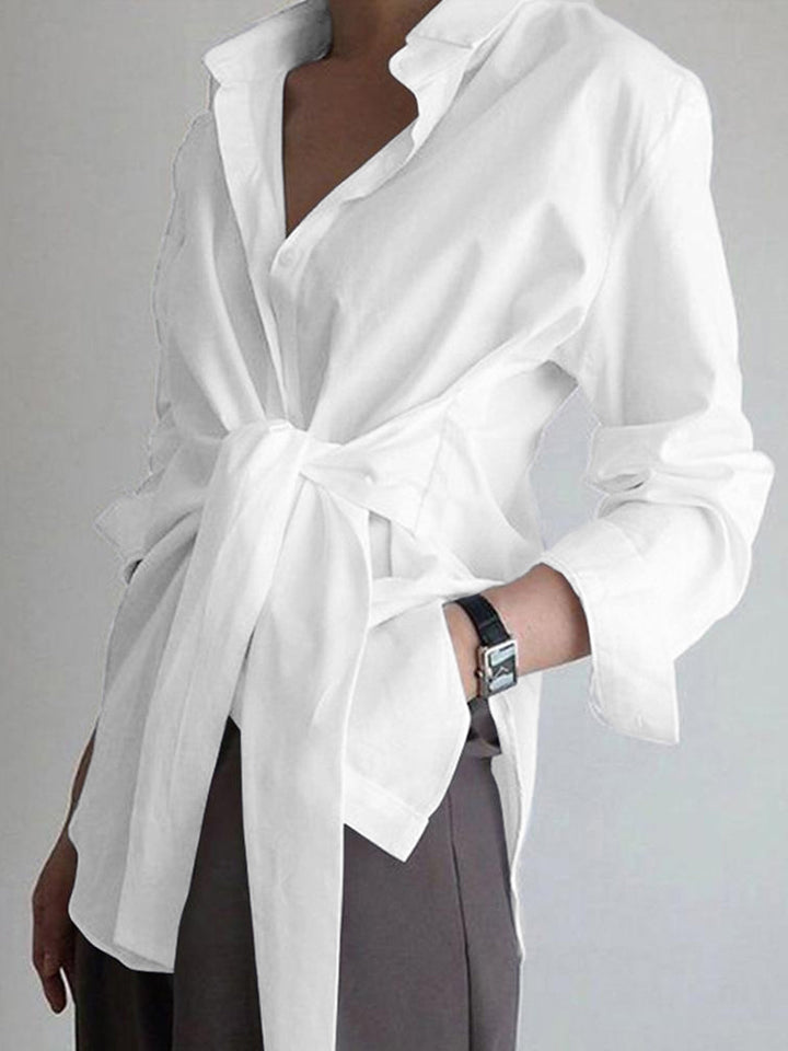 Professional women's elegant shirt with tie belt, a stylish long sleeve top for office and business wear.