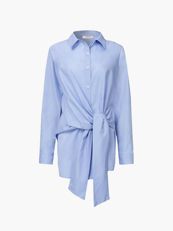 Sophisticated women's elegant long sleeve shirt with a stylish tie belt, offering timeless fashion and comfort.