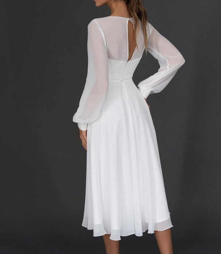 Flattering long sleeve V-neck formal dress for women. Ideal for elegant parties, weddings, or special occasion wear.