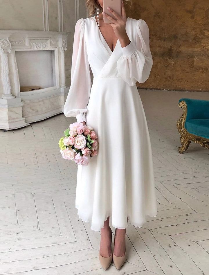 Elegant women's long sleeve wrap cocktail midi dress in chiffon, perfect for evening parties and formal events.