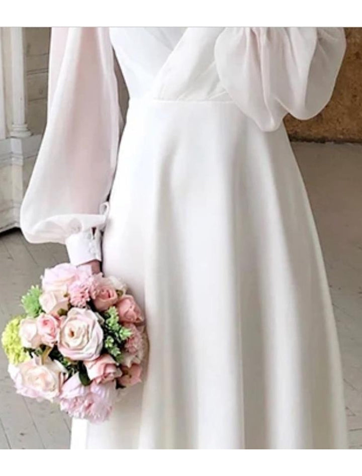 Fashionable long sleeve women's cocktail dress, a formal wrap midi style in chiffon for evening wear.