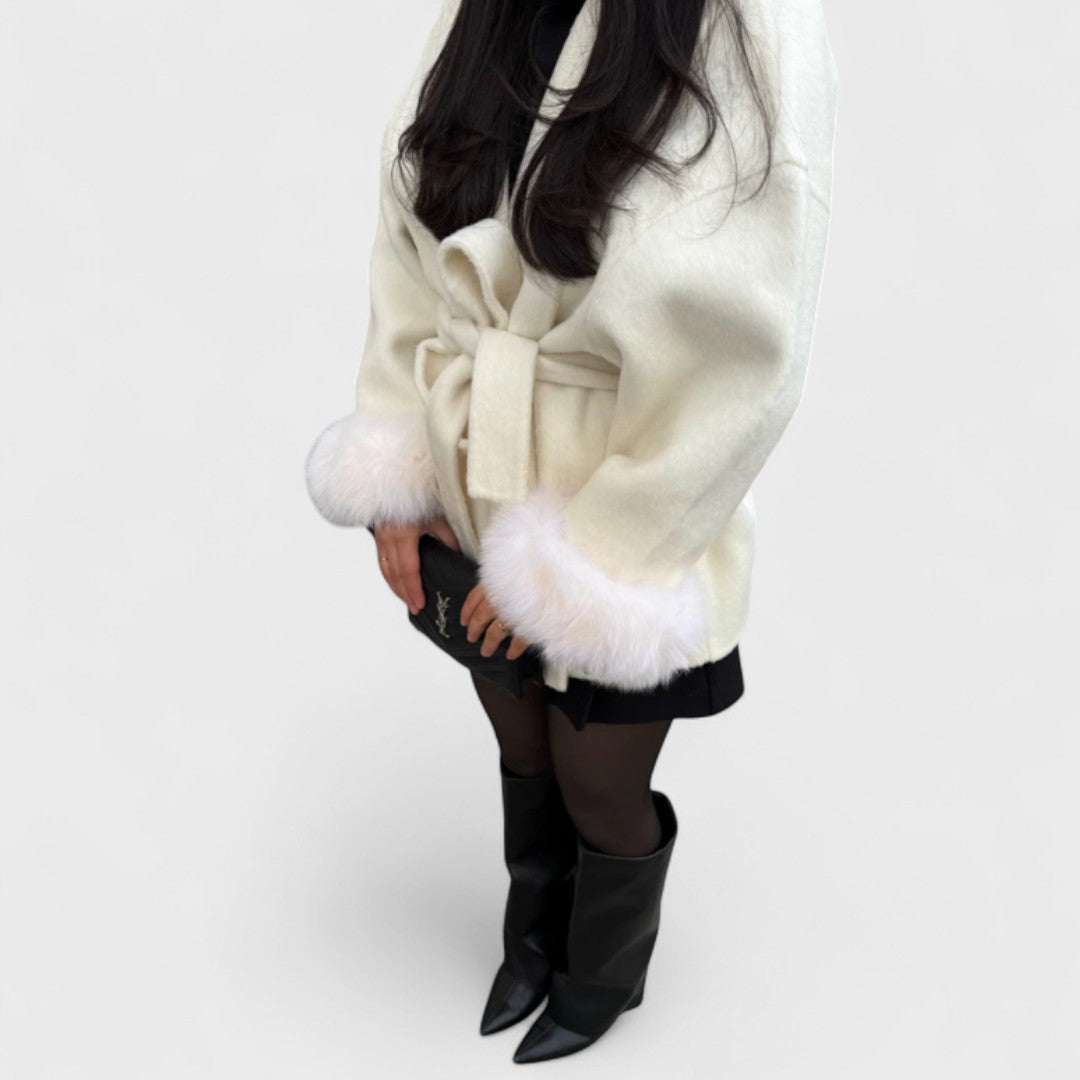 Chic women's elegant jacket featuring a stylish faux fur trim, ideal for fashionable seasonal wear.