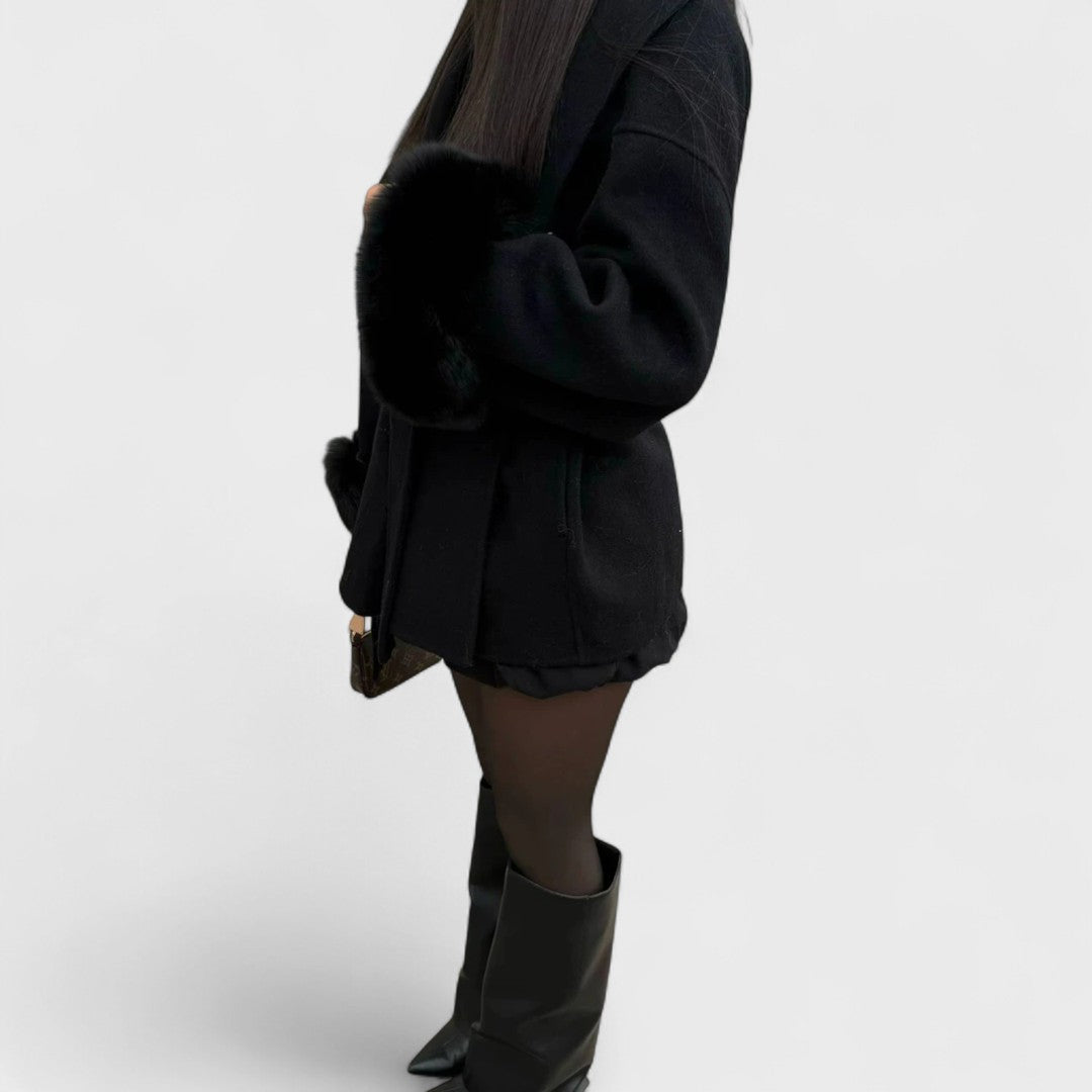 Warm outerwear: Women's long coat with soft faux fur details, designed for winter fashion and comfort.