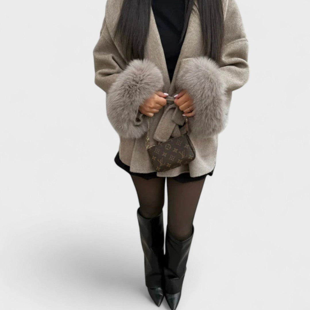 Stylish women's jacket with prominent faux fur details, a must-have for elegant winter fashion.
