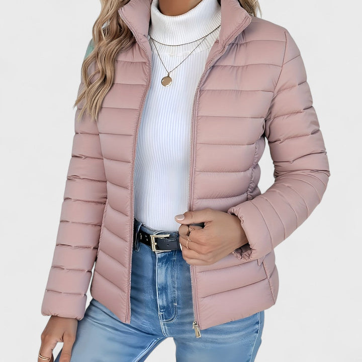Graceful women's longline quilted jacket, high collar detail, an elegant and practical choice for autumn wear.