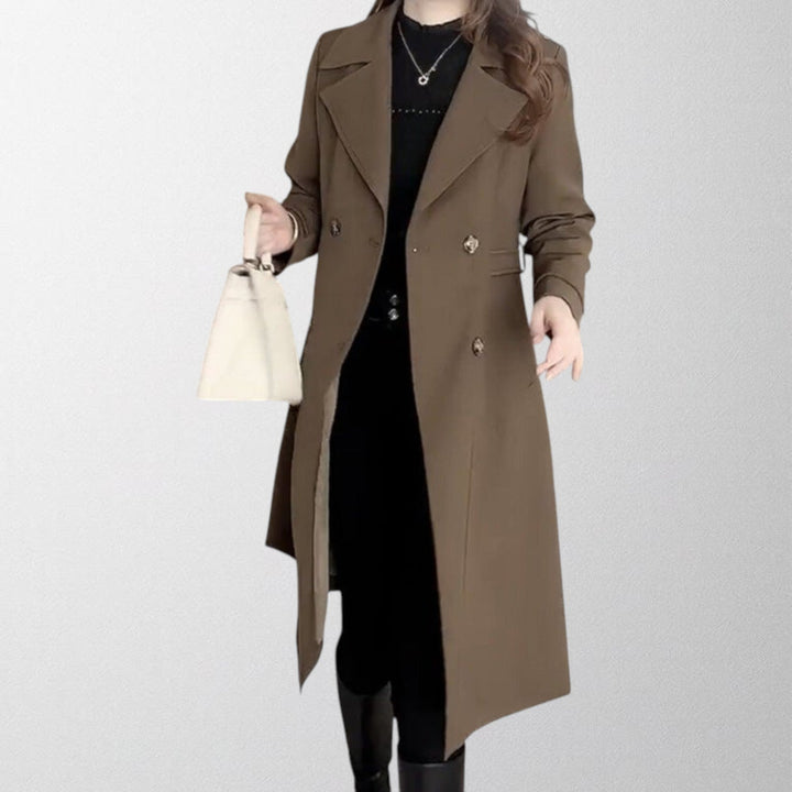 Stylish women's longline trench coat, sophisticated outerwear for a fashionable spring or fall look.