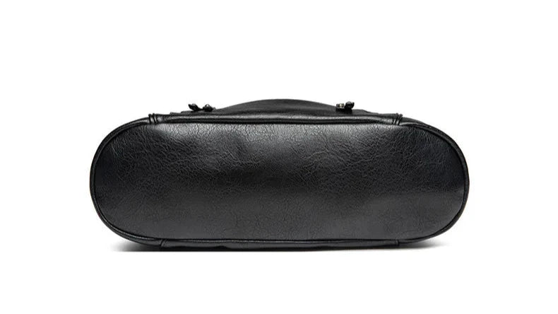 Women's black vegan leather shoulder bag with a crossbody option, enhanced versatility