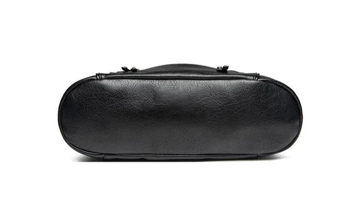 Women's black vegan leather shoulder bag with a crossbody option, enhanced versatility