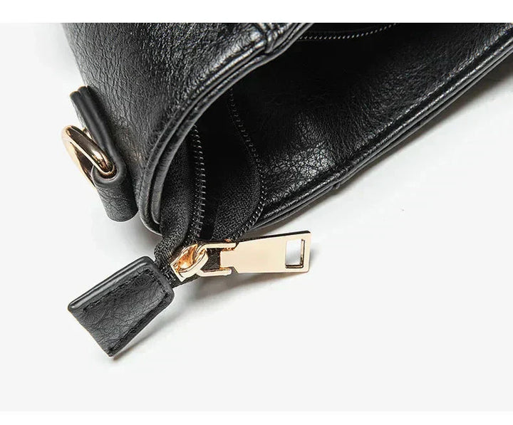 Interior view of the women's luxe vegan leather shoulder bag, featuring organized compartments