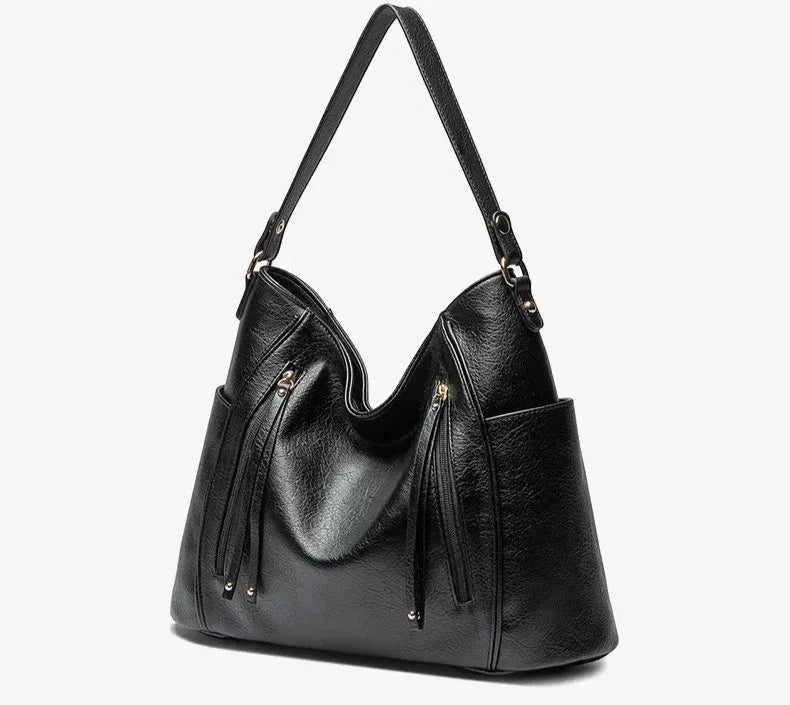 Women's vegan leather shoulder bag featuring an adjustable strap for comfortable wear