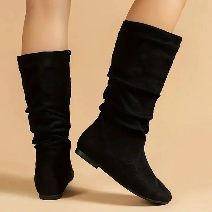 Elegant women's mid-calf boots with a sleek design and practical side zipper, perfect for chic everyday fashion.