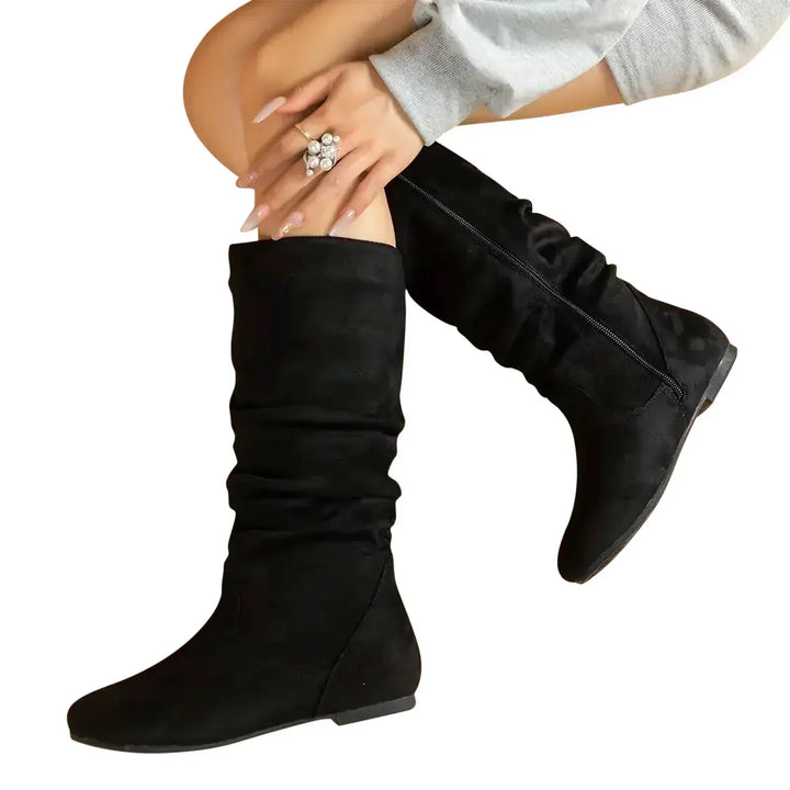 Versatile ladies' mid-calf boots featuring a comfortable fit and convenient side zipper for stylish spring outfits.