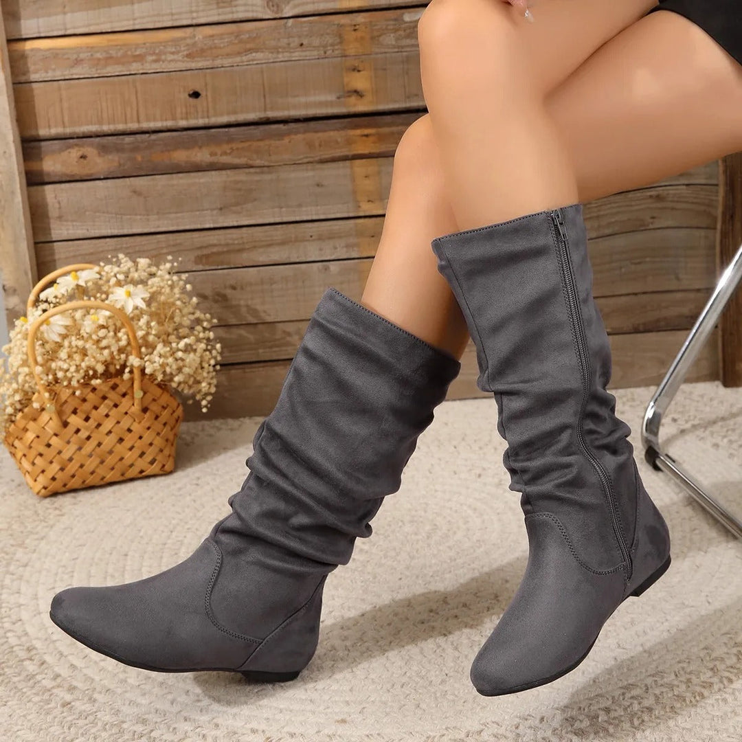 Fashionable mid-calf boots for women, designed for comfort & elegance with an easy-to-use side zipper closure.