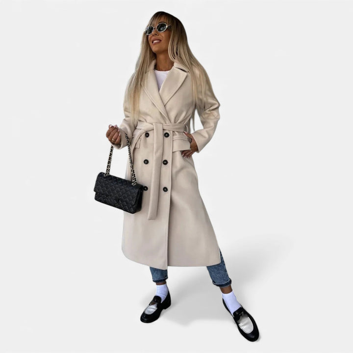 Women's classic belted lapel coat. Mid-length elegant overcoat for stylish outerwear.