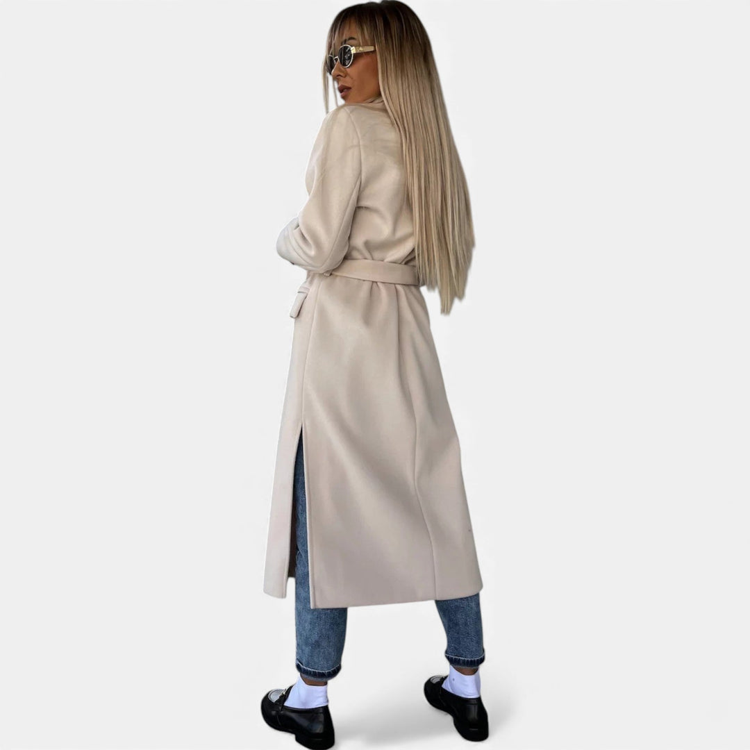 Mid-length belted overcoat for women. Elegant lapel coat, classic winter outerwear style.