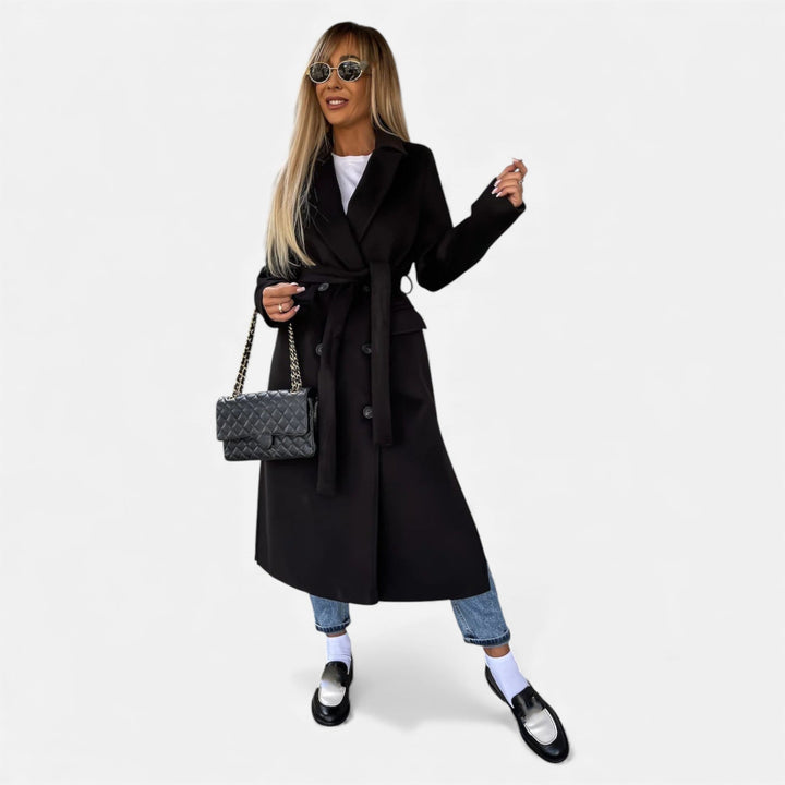 Stylish women's mid-length overcoat. Belted lapel coat, warm winter outerwear.