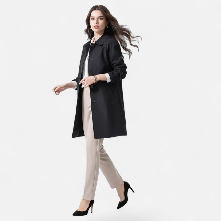 Black women's mid-length trench coat, versatile for autumn & spring fashion. Chic & timeless outerwear.