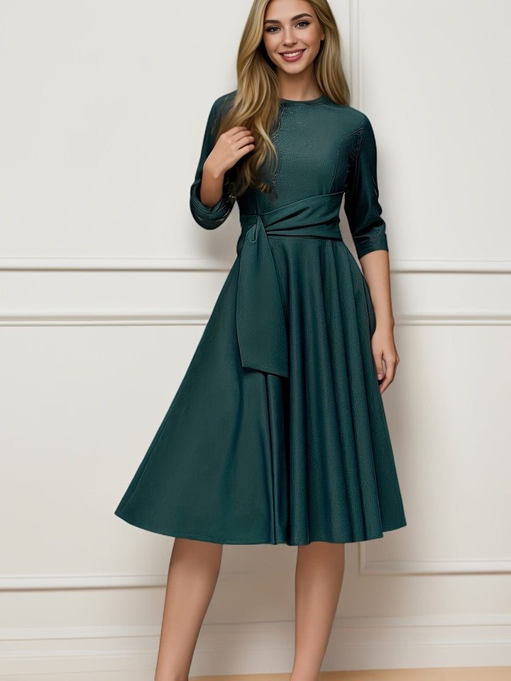 Stylish women's bow midi blouse for elegant fashion. Features 3/4 sleeves, perfect for a chic office or party look.