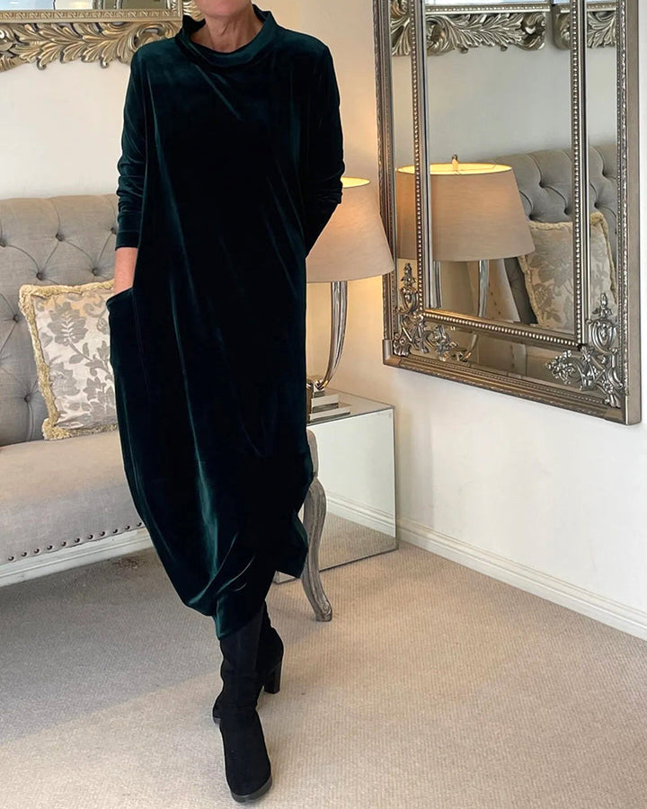 Modern women's versatile dress, comfortable midi cut, long sleeves, round neck, and deep pockets.