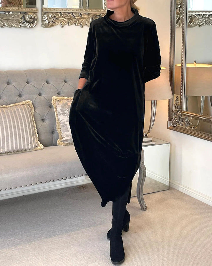 Sleek women's long sleeve midi dress, features a round neck, elegant cut, and handy pockets.
