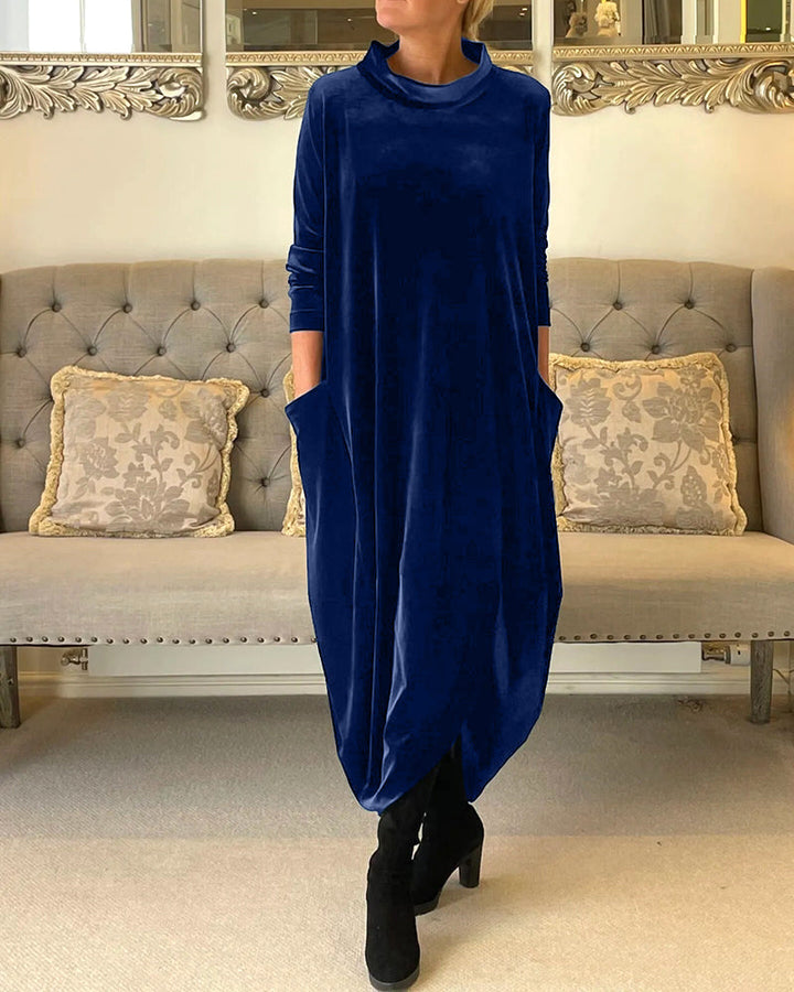 Versatile women's dress with pockets, elegant design, long sleeves, and a flattering round neck.