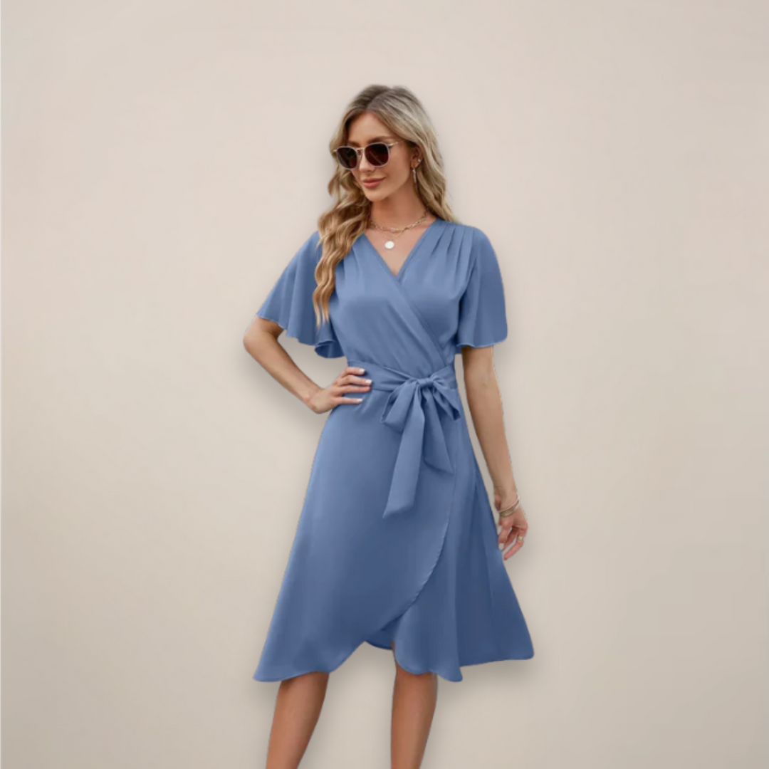 Elegant women's midi wrap dress in flowing fabric with a flattering front tie, perfect for summer vacation.