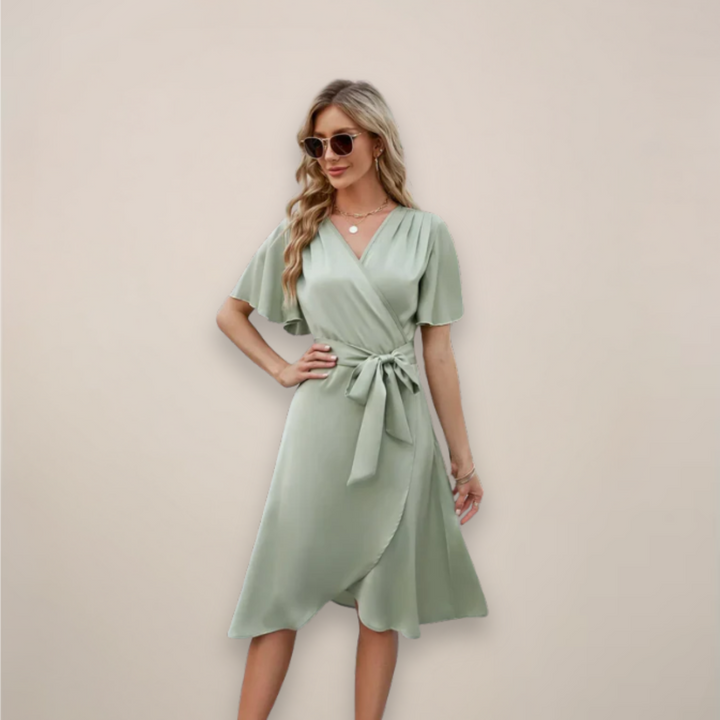 Front view of a women's elegant midi wrap dress, showcasing its flattering silhouette and chic front tie.