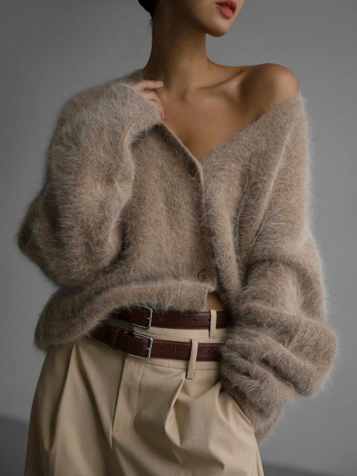 Neutral colored women's elegant cardigan, made from lightweight nylon knit, with classic button front.