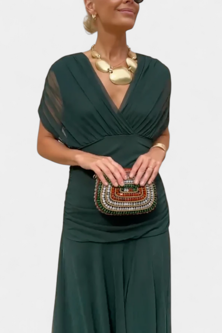 Close-up of the elegant off-shoulder detail of a ruched maxi dress for women