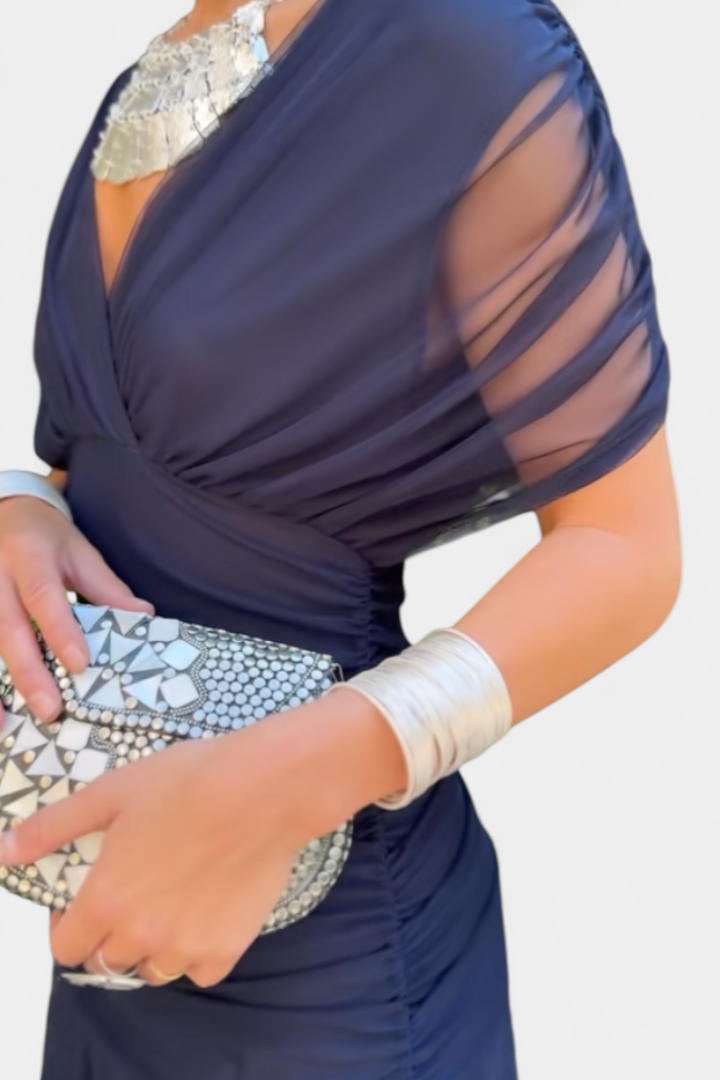 Full-body shot of an elegant off-shoulder ruched maxi dress, ideal for formal gatherings