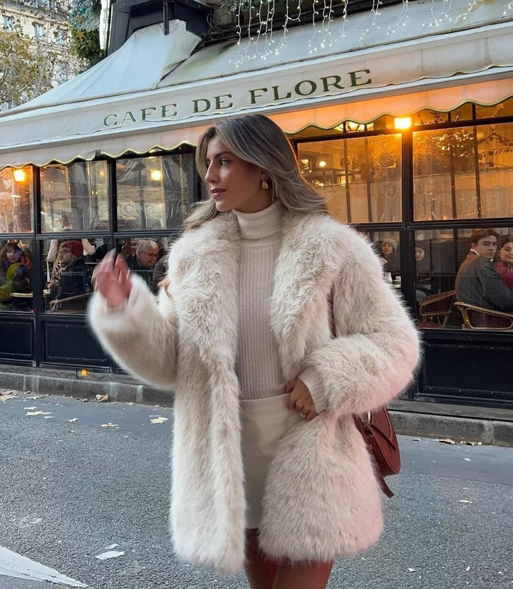 Elegant women's off-white winter jacket for chic style, offering warmth and a sophisticated look for cold weather.