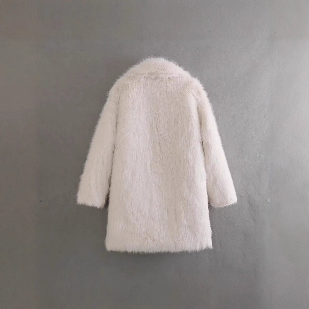 Warm women's elegant off-white winter coat. Chic outerwear providing cozy comfort and a sophisticated look for cold days.
