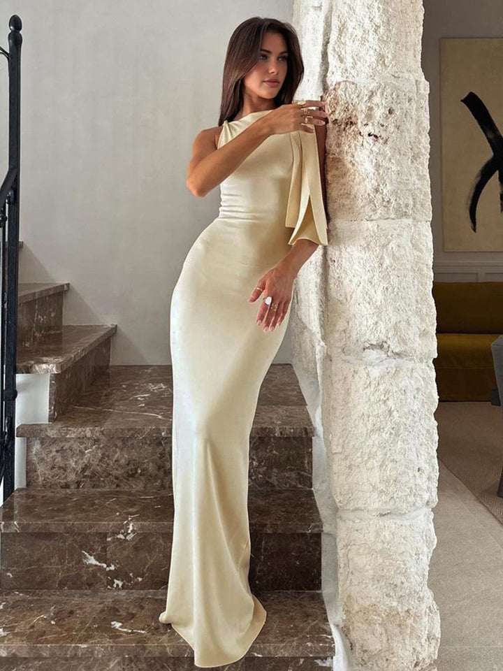 Stylish off-white one-shoulder maxi dress for women, featuring an asymmetrical design, ideal for formal events.