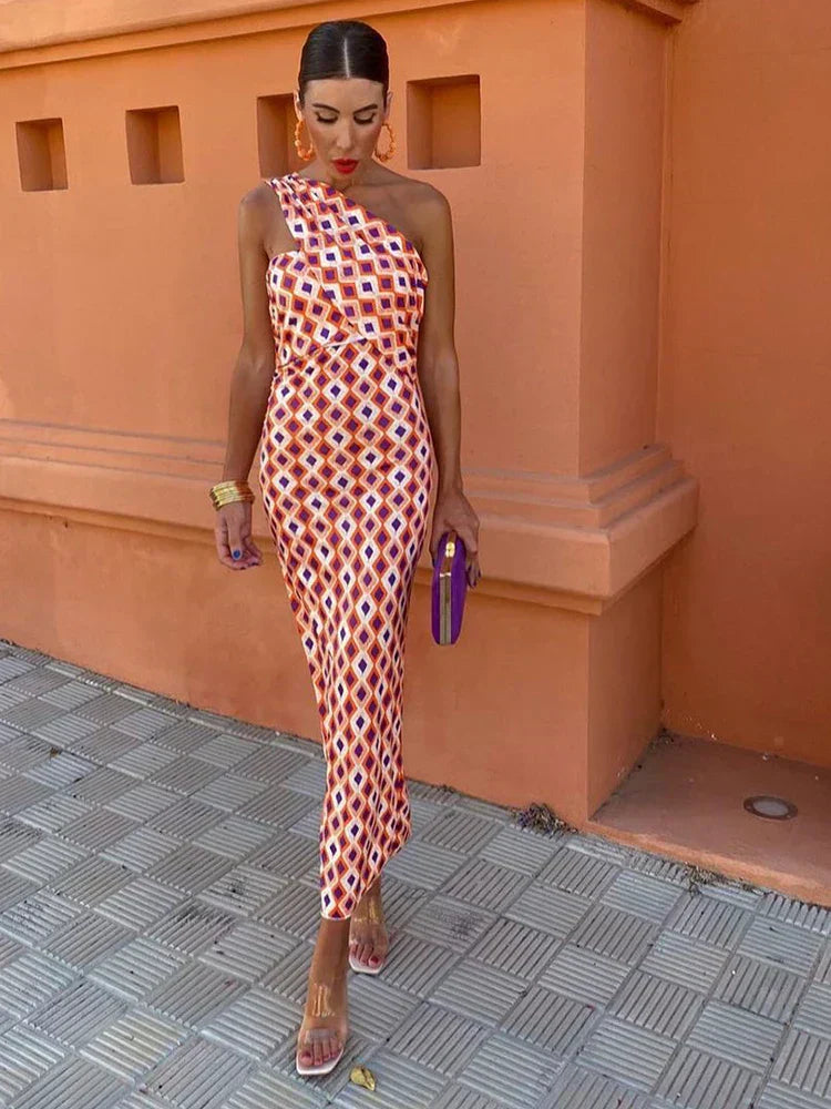 Elegant women's one-shoulder flowy maxi dress in light blue, perfect for summer parties or vacation.