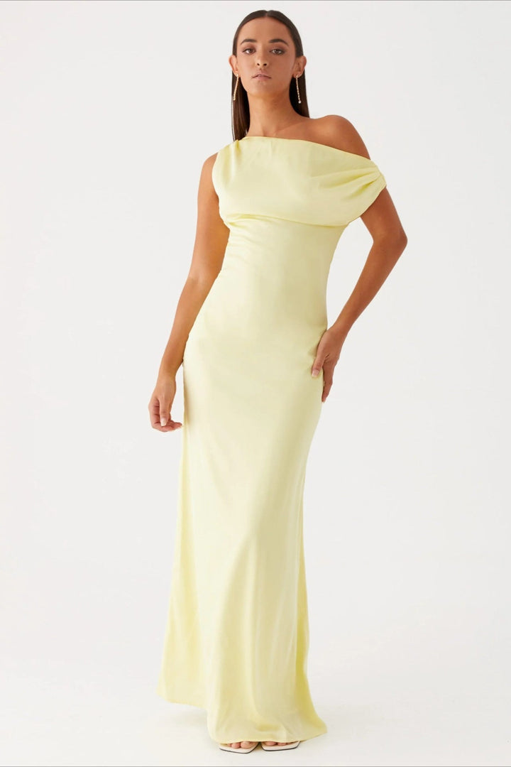 Women's elegant one-shoulder maxi dress, showcasing a high-waist and unique asymmetric cut for events.