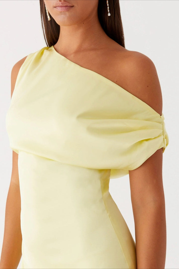 Fashionable women's maxi dress: one-shoulder, high-waist, and sleek asymmetric silhouette for evenings.